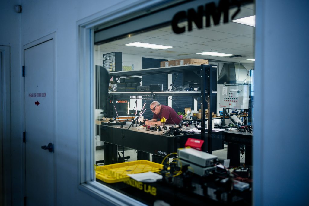 Brian Rashap, a professor at Central New Mexico Community College, sets up equipment for a quantum training lab. Sandia National Laboratories is teaming up with the college to create a Quantum Technician Bootcamp, which is a 10-week immersive program that will launch in the fall. (Photo by Craig Fritz) Click on the thumbnail for a high-resolution image.