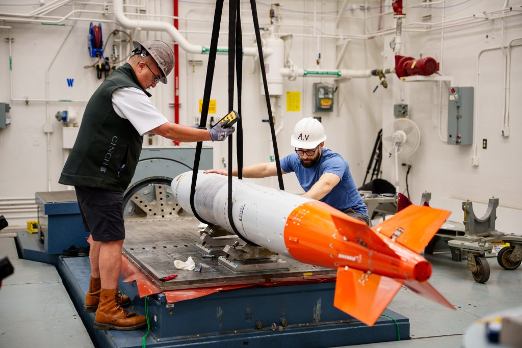 A B61-13 vibration fly around unit is prepared for testing on a shaker table at Sandia National Laboratories. Assembly of the first production unit of the gravity bomb was completed at the Pantex Plant in May, about a year ahead of schedule. (Photo by Craig Fritz) Click on the thumbnail for a high-resolution image.