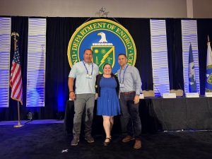 Rick Arteaga, left, and Jason Miller, right, of Strategic Industry Inc., join Sandia Mentor-Protégé Program Lead Royina Lopez, center, at a Department of Energy Event as part of the Mentor-Protégé Program. (Photo by Patricia Brown) Click on the thumbnail for a high-resolution image.